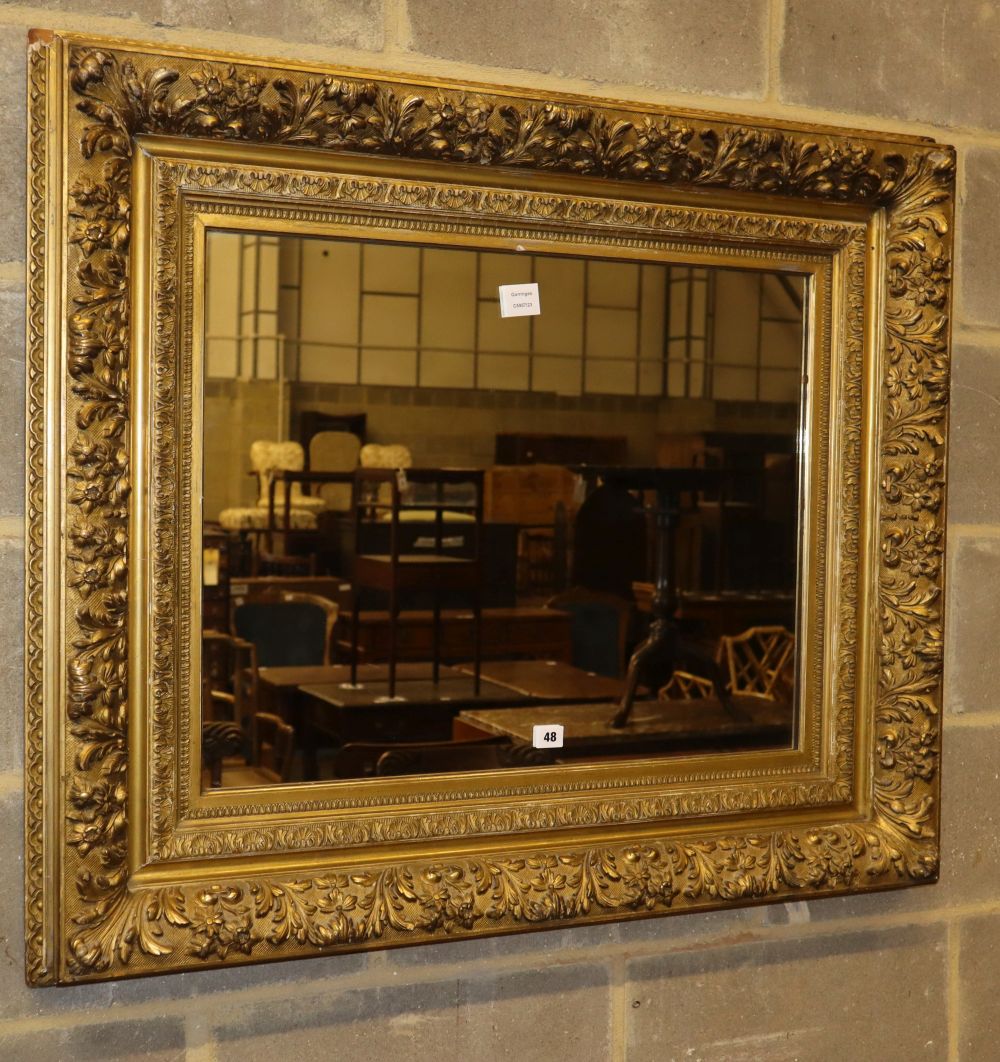 A late Victorian gilt carved wood picture frame wall mirror, W.102cm, H.86cm